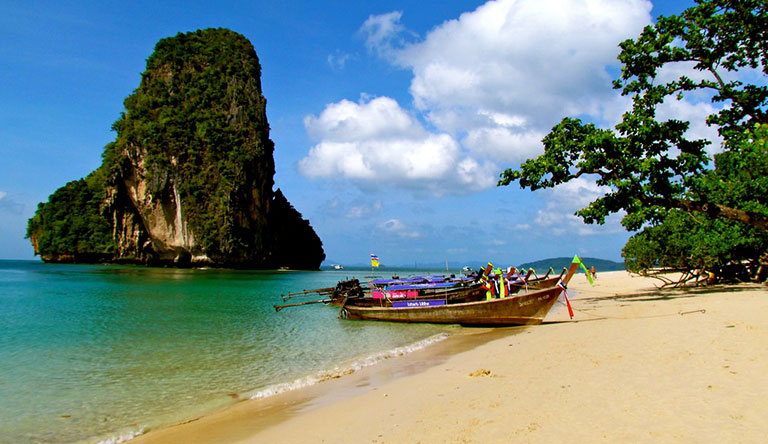 boat-docked-near-beach-phuket-thailand