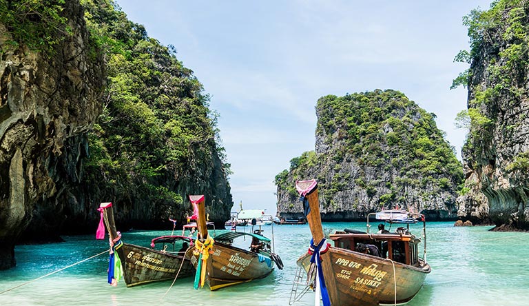 traditional-boats-on-the-beach-phuket-thailand